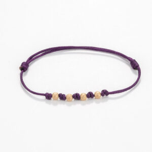 Nylon cord bracelet with gold beads